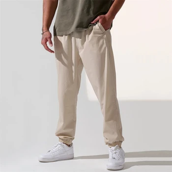 2023 Спортивные штаны для бега трусцой Мужские хлопчатобумажные Повседневные Узкие брюки для тренировок по бодибилдингу Черные Брюки Мужские брюки для спортзала